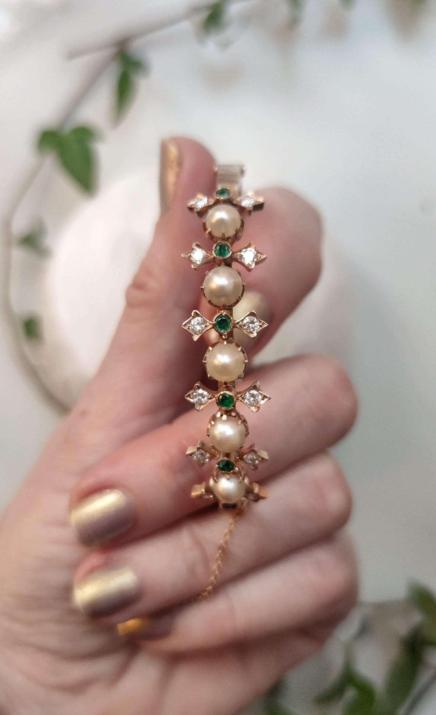 Princess cuff with diamonds, pearls and emeralds.