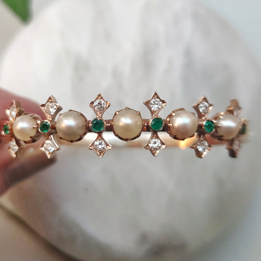 Princess cuff with diamonds, pearls and emeralds.
